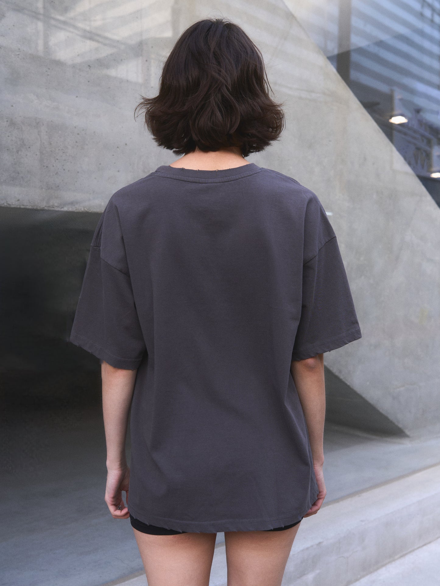 Candelabrum oversized t-shirt — close-up of discharge print texture and hand-distressed finish