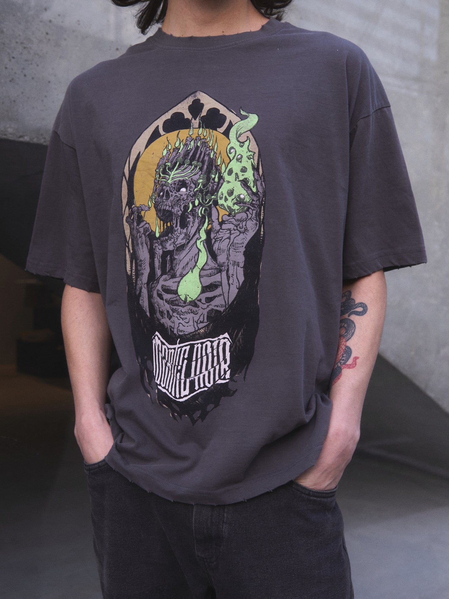 Candelabrum oversized t-shirt — title image showing discharge-printed skull and candelabrum graphic on black cotton