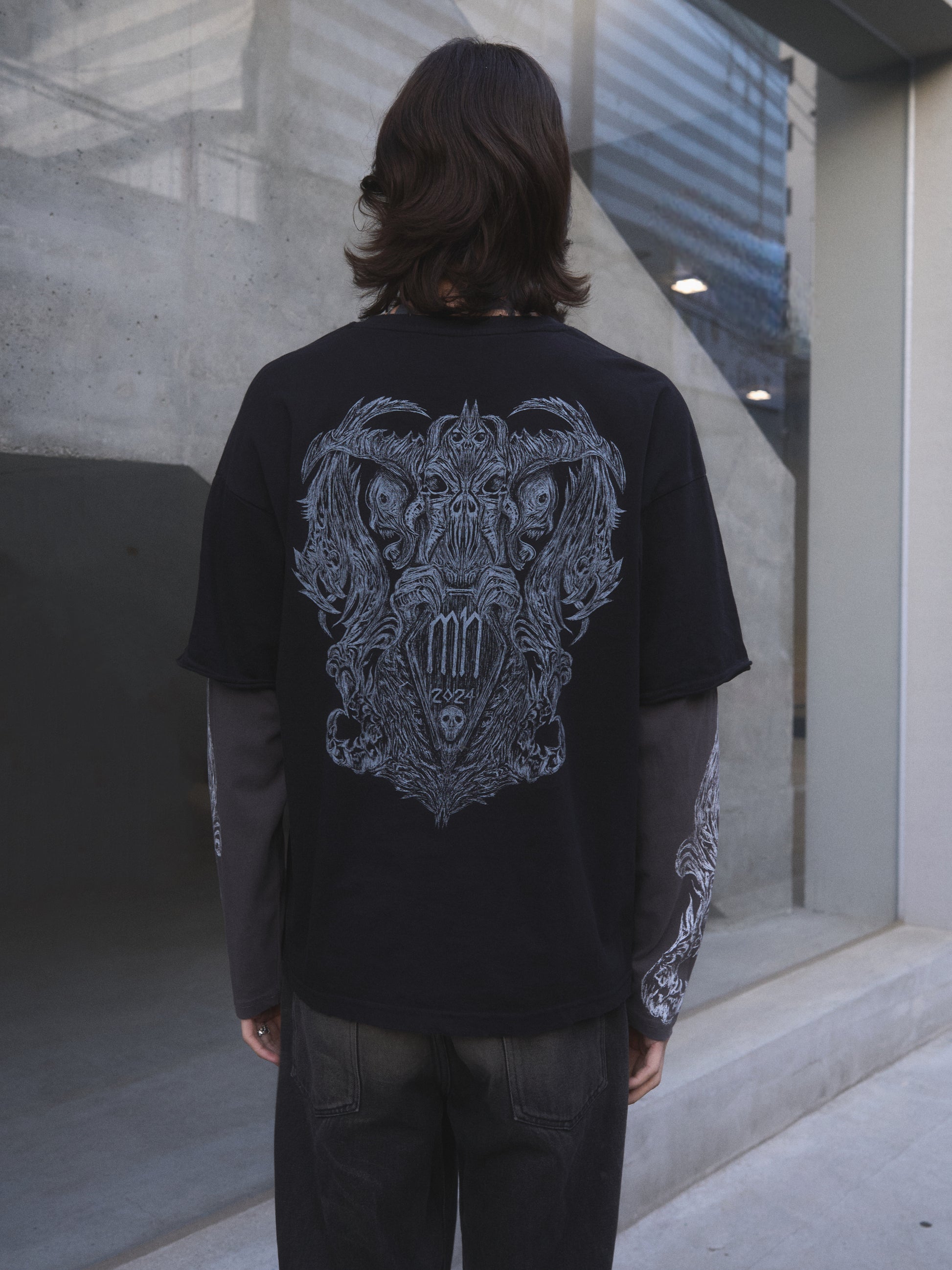 Demonic Heraldry oversized t-shirt — back view of occult heraldic print on heavyweight black cotton