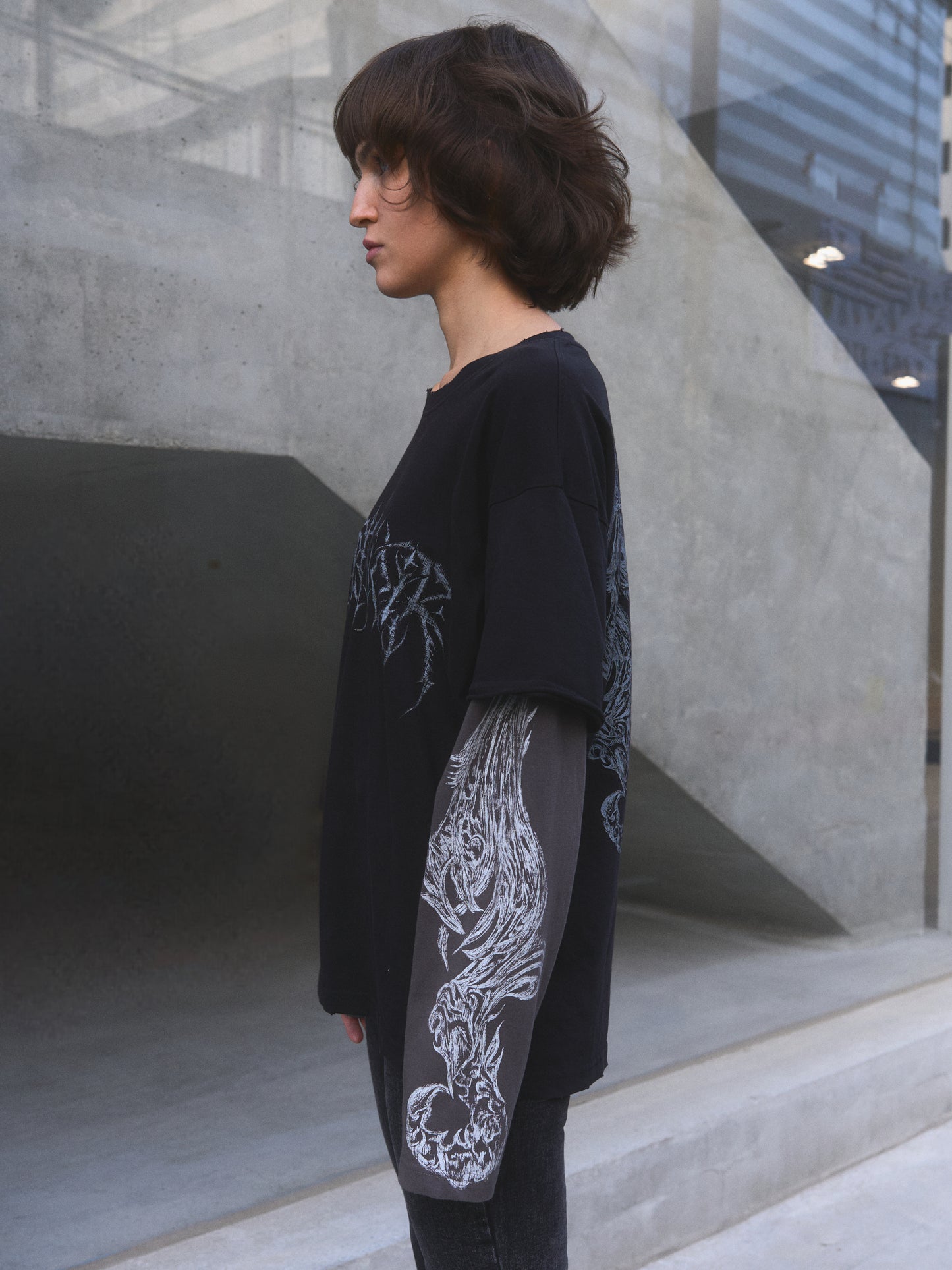 Demonic Heraldry oversized t-shirt — detail of hand-distressed collar and hem finish