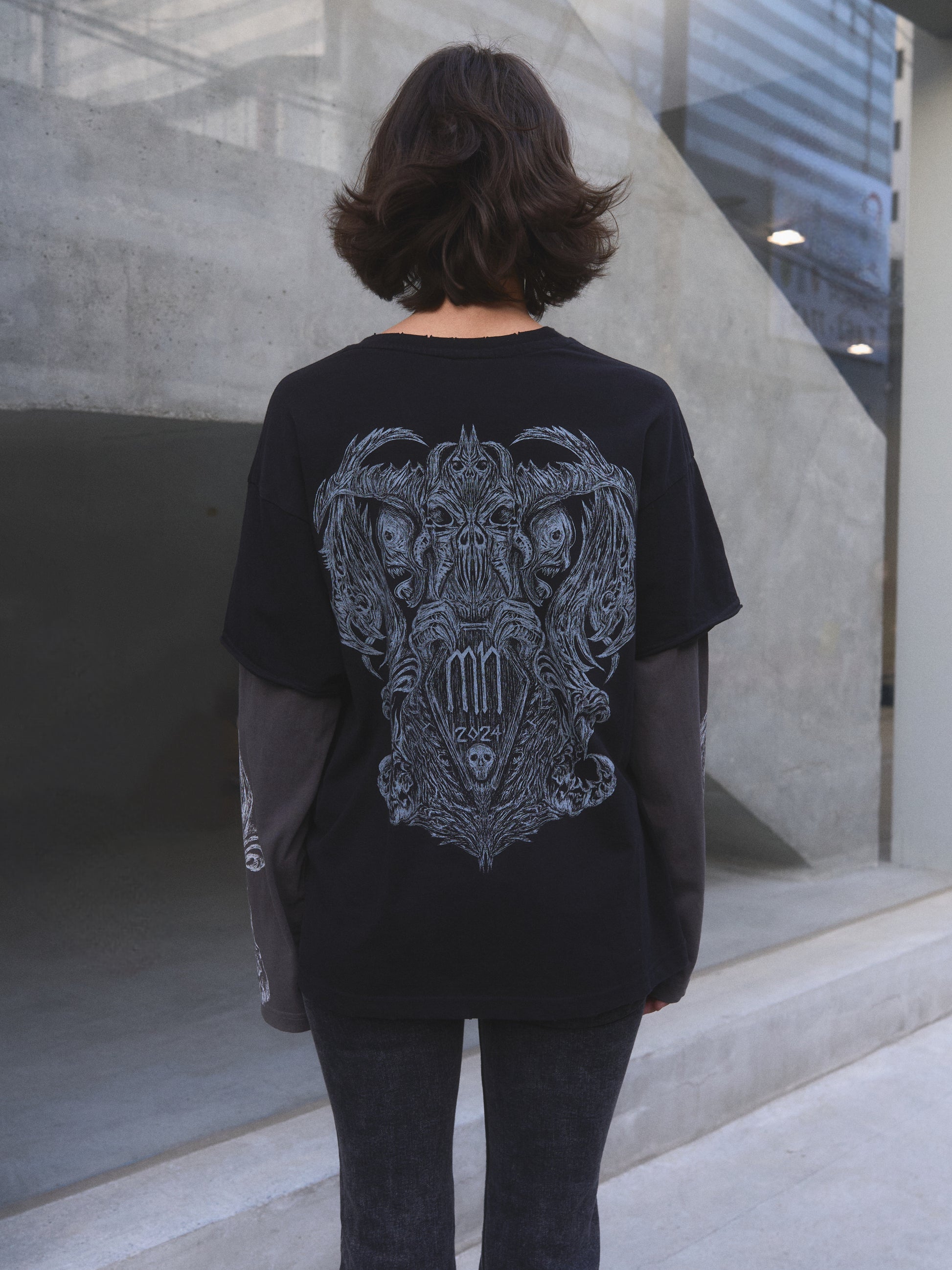 Model wearing Demonic Heraldry oversized t-shirt by Mortisnoir — full lookbook shot